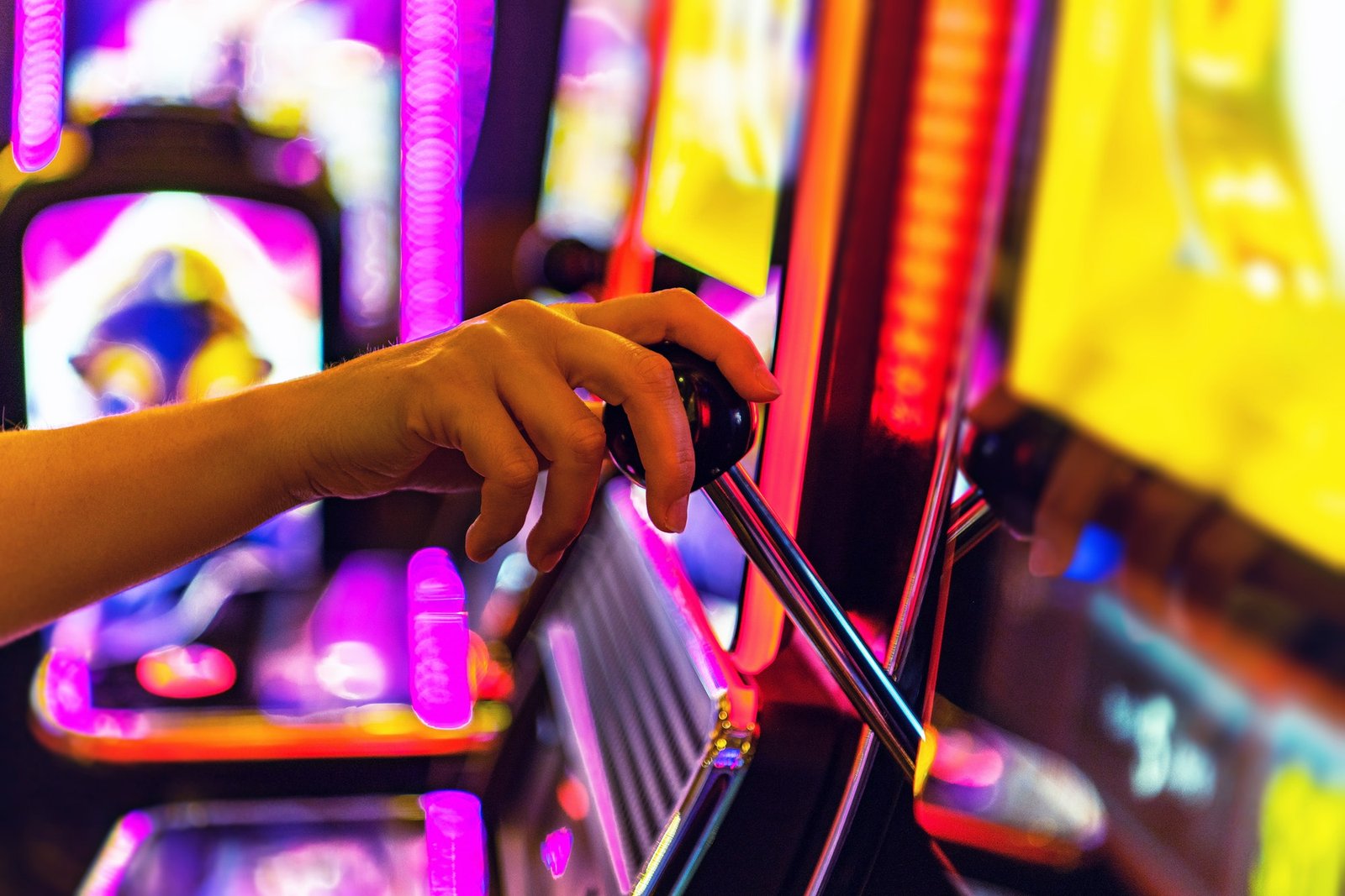woman-playing-one-handed-casino-slot-game.jpg